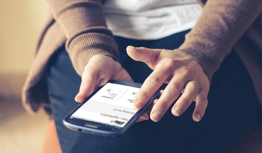 Woman navigating iWorQ citizen portal on smartphone